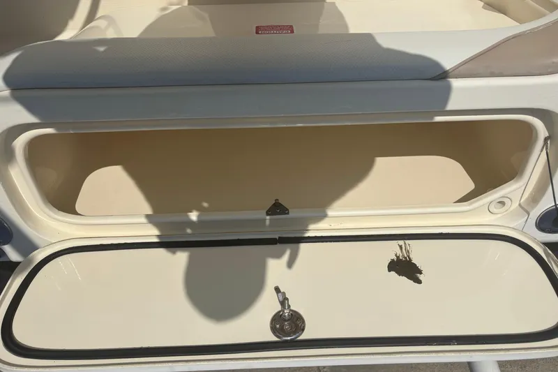 Slide: The Image of Open storage compartment on a 2006 Scout 282 Sportfish boat. - 21