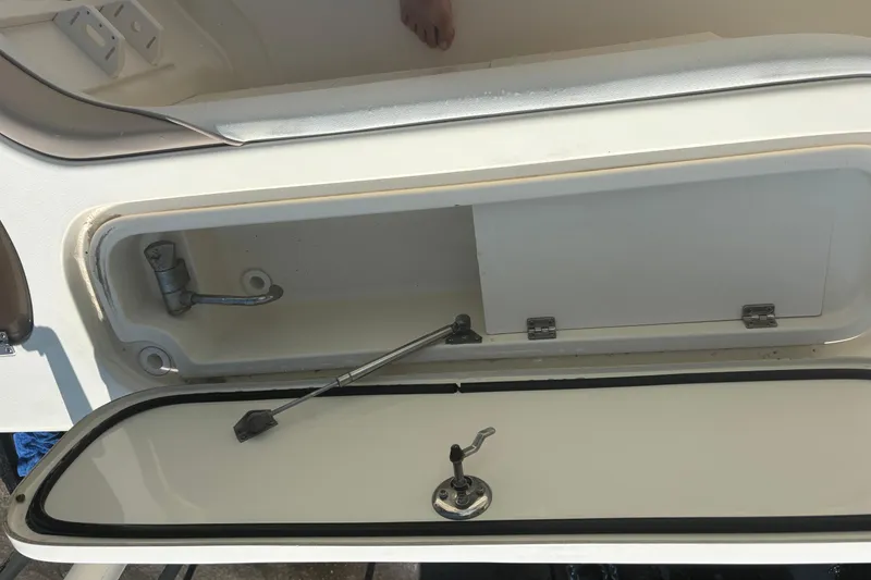 Slide: The Image of Open storage compartment on a 2006 Scout 282 Sportfish boat. - 23