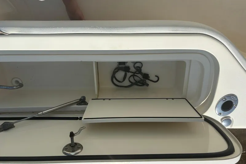Slide: The Image of Open storage compartment on a 2006 Scout 282 Sportfish boat, showing interior details. - 24