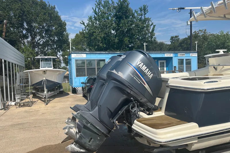 Slide: The Image of 2006 Scout 282 Sportfish boat with Yamaha outboard motor in a marina setting. - 28