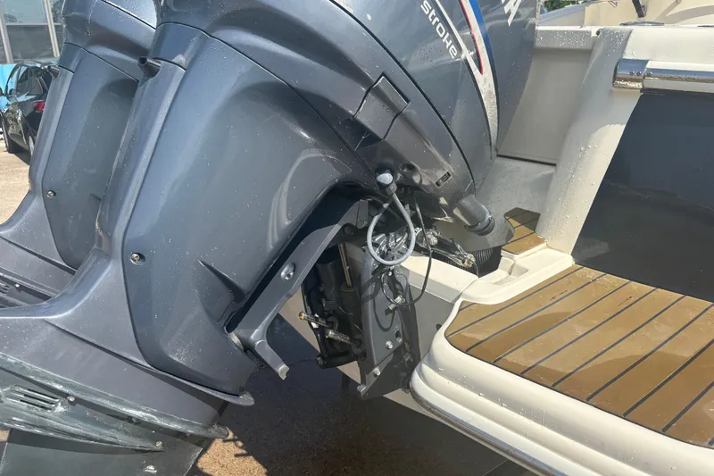 Slide: The Image of 2006 Scout 282 Sportfish boat with dual outboard motors and teak deck. - 29