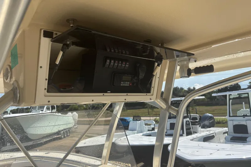 Slide: The Image of 2006 Scout 282 Sportfish boat console with electronic controls and storage compartment. - 3