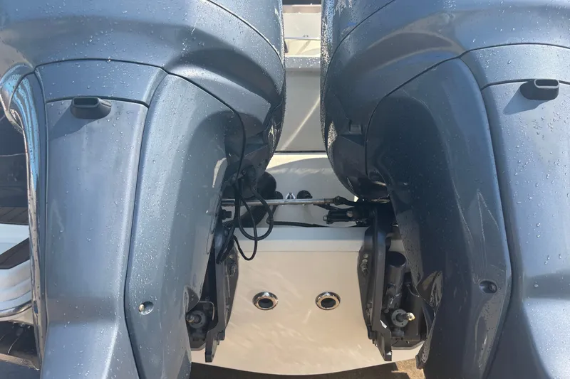 Slide: The Image of Twin outboard motors on a 2006 Scout 282 Sportfish boat, close-up view. - 30