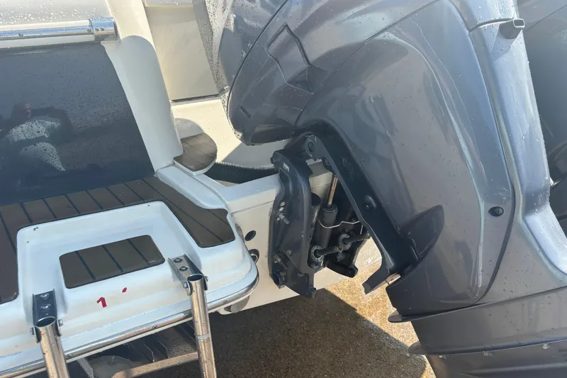 Slide: The Image of 2006 Scout 282 Sportfish boat with outboard motor and swim platform. - 31