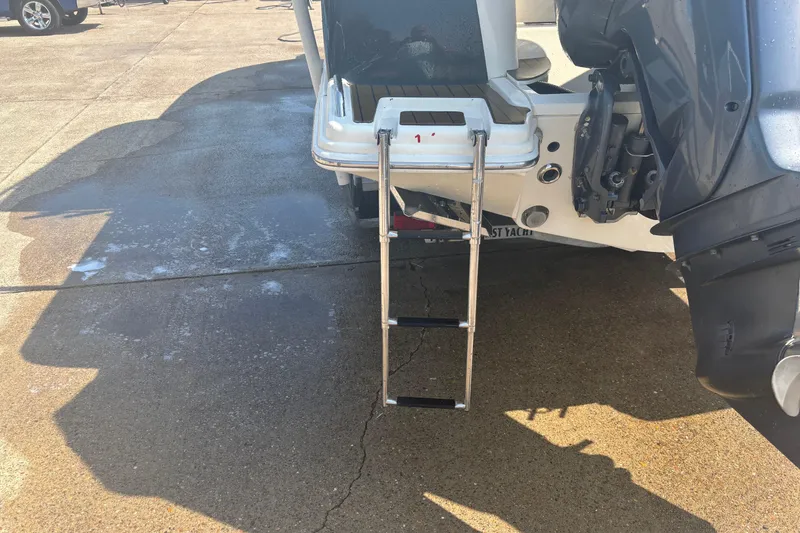 Slide: The Image of Rear view of 2006 Scout 282 Sportfish with ladder and outboard motor. - 32