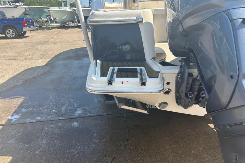 Slide: The Image of 2006 Scout 282 Sportfish boat with outboard motor and swim platform. - 33