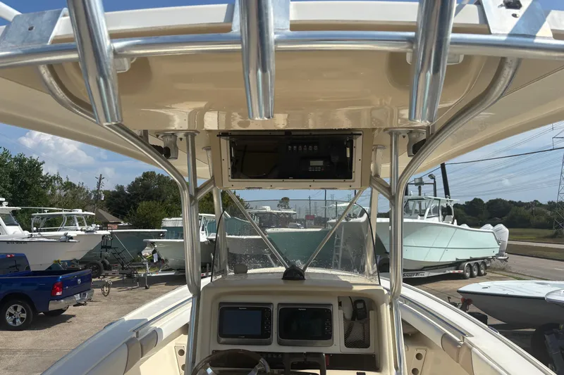 Slide: The Image of 2006 Scout 282 Sportfish boat interior with navigation equipment and overhead console. - 4