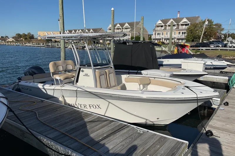 The Image of 2016 Sea Fox 226 Commander boat docked at marina with waterfront homes. - 0