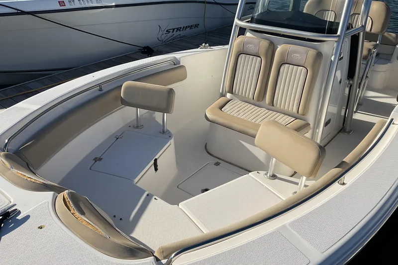 Slide: The Image of 2016 Sea Fox 226 Commander boat interior with beige seating and console. - 2