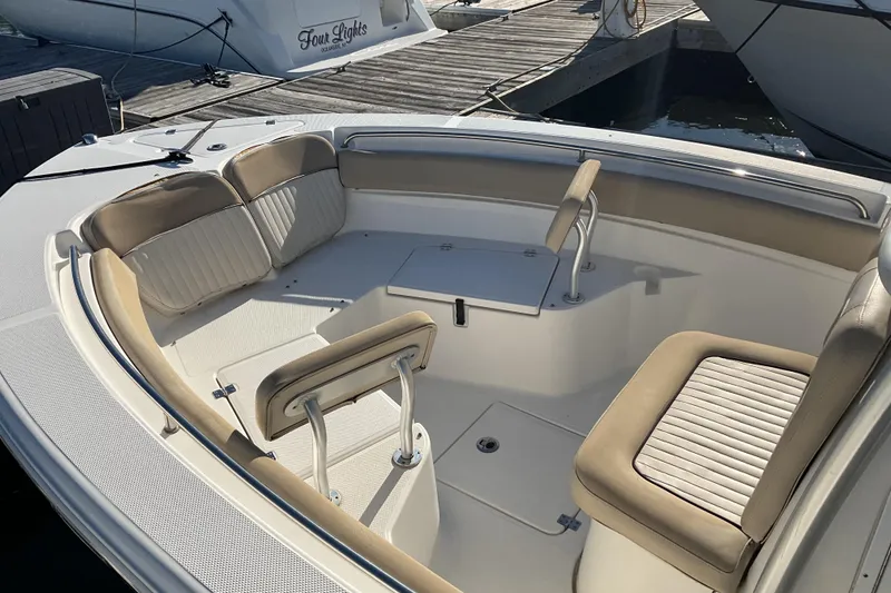 Slide: The Image of 2016 Sea Fox 226 Commander boat interior with cushioned seating and storage compartments. - 3