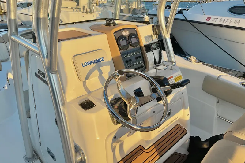 Slide: The Image of 2016 Sea Fox 226 Commander boat console with steering wheel and Lowrance equipment. - 5