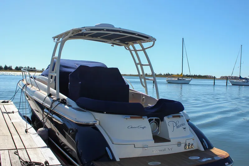 Slide: The Image of 2017 Chris-Craft Launch 38 docked, featuring sleek design and luxurious seating. - 100