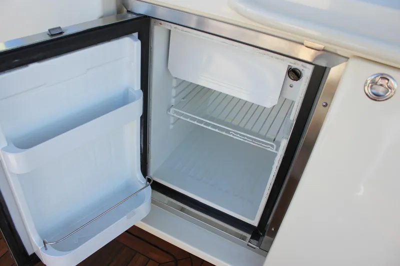 Slide: The Image of 2017 Chris-Craft Launch 38 boat with elegant blue and white seating on teak deck. - 22