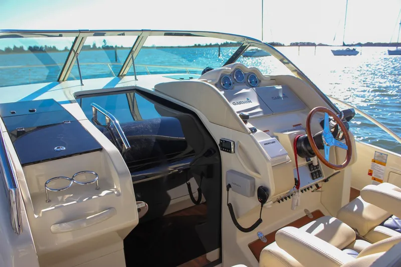 Slide: The Image of 2017 Chris-Craft Launch 38 boat with elegant seating and twin engines at dock. - 23