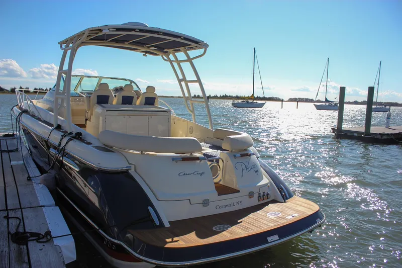 Slide: The Image of 2017 Chris-Craft Launch 38 docked in a scenic marina setting. - 3