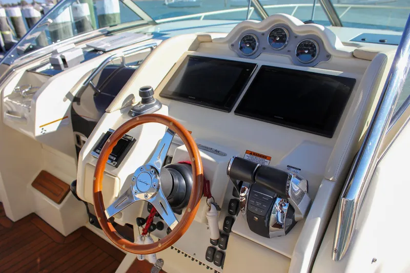 Slide: The Image of Luxurious seating on 2017 Chris-Craft Launch 38 boat with blue and white upholstery. - 34