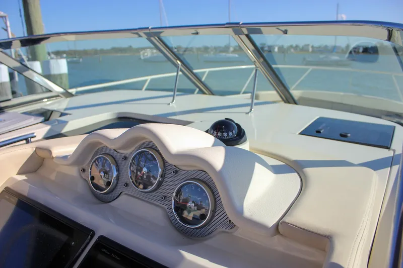 Slide: The Image of Interior of 2017 Chris-Craft Launch 38 boat with steering wheel and communication devices. - 35
