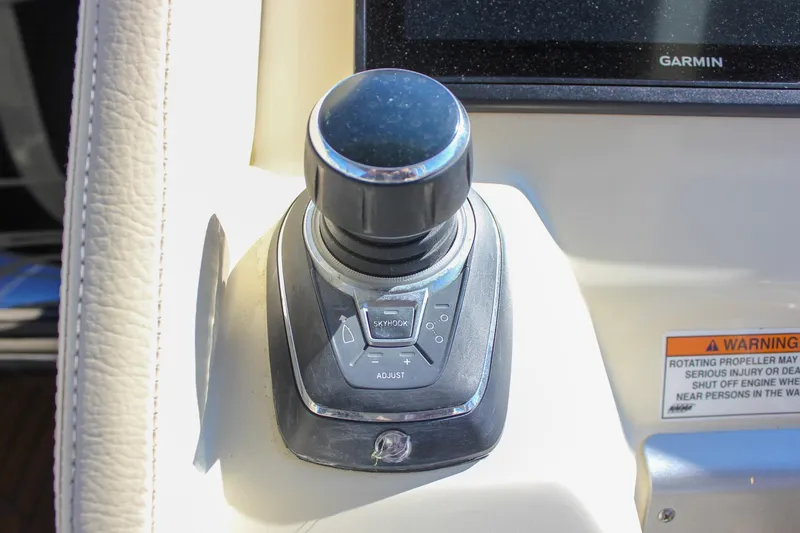 Slide: The Image of 2017 Chris-Craft Launch 38 helm with Garmin navigation and Mercury controls on sunny waters. - 36