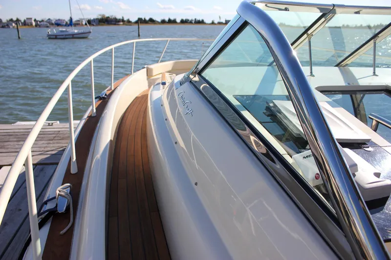 Slide: The Image of Control panel of a 2017 Chris-Craft Launch 38 boat with warning labels. - 37