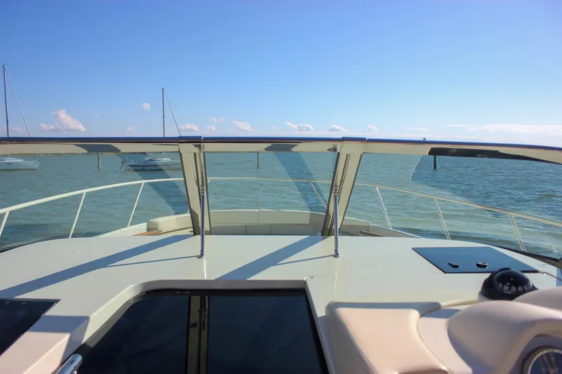 Slide: The Image of Steering wheel and controls of 2017 Chris-Craft Launch 38 boat cockpit. - 39