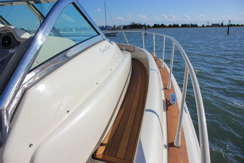 Slide: The Image of 2017 Chris-Craft Launch 38 dashboard with wooden steering wheel and modern controls. - 42