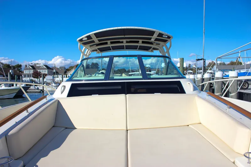 Slide: The Image of 2017 Chris-Craft Launch 38 cockpit with wooden flooring and Mercury controls. - 46