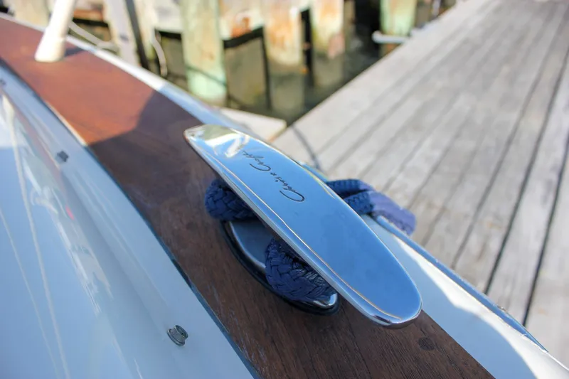 Slide: The Image of 2017 Chris-Craft Launch 38 boat with elegant seating and teak flooring at a dock. - 49