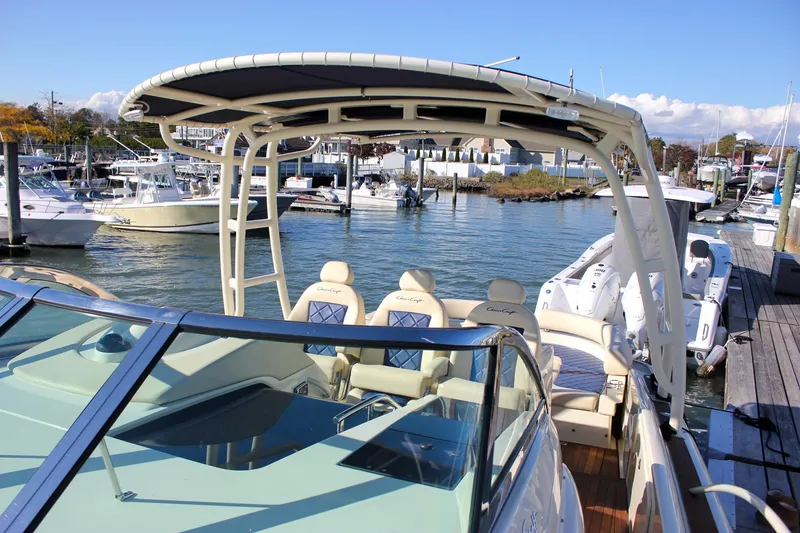 Slide: The Image of 2017 Chris-Craft Launch 38 boat with teak deck, cruising on water. - 53