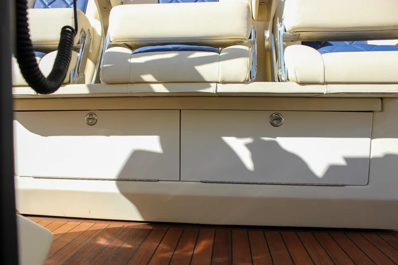 Slide: The Image of 2017 Chris-Craft Launch 38 boat with spacious seating at a marina. - 58
