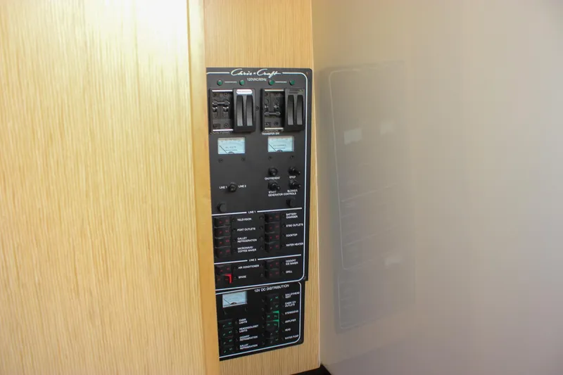 Slide: The Image of 2017 Chris-Craft Launch 38 boat interior with cushioned seating and wooden deck. - 59