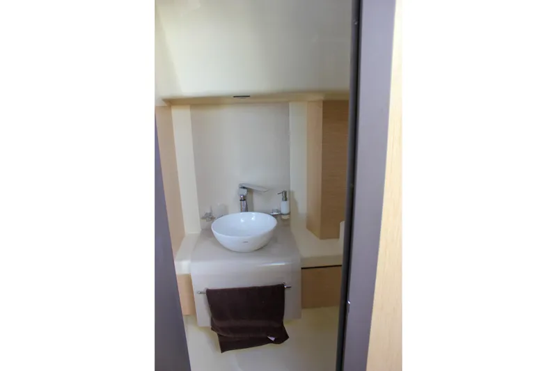 Slide: The Image of Luxurious seating on 2017 Chris-Craft Launch 38 boat, featuring elegant blue and beige upholstery. - 65