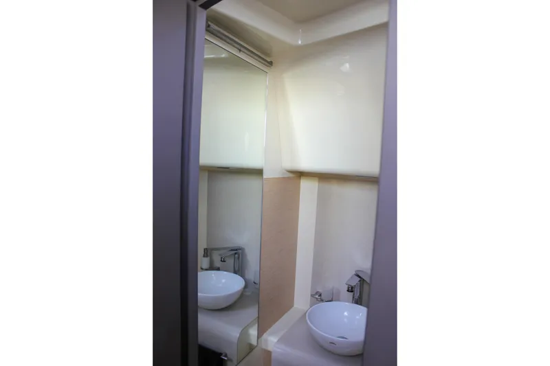 Slide: The Image of 2017 Chris-Craft Launch 38 interior seating with storage, featuring elegant wood flooring. - 66