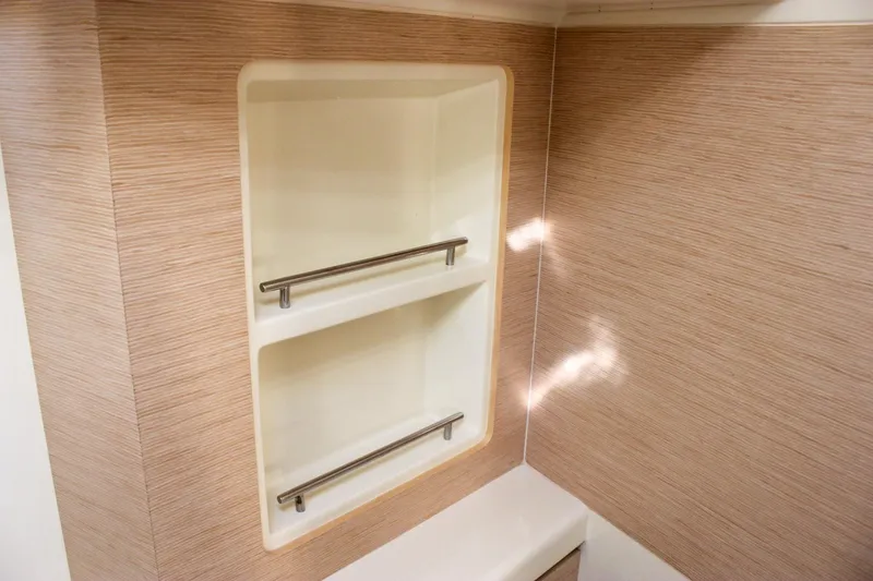 Slide: The Image of Cozy cabin interior of 2017 Chris-Craft Launch 38 with decorative pillows. - 68