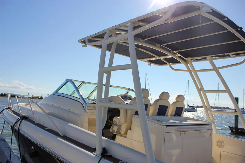 Slide: The Image of 2017 Chris-Craft Launch 38 boat cruising on calm waters under cloudy skies. - 7