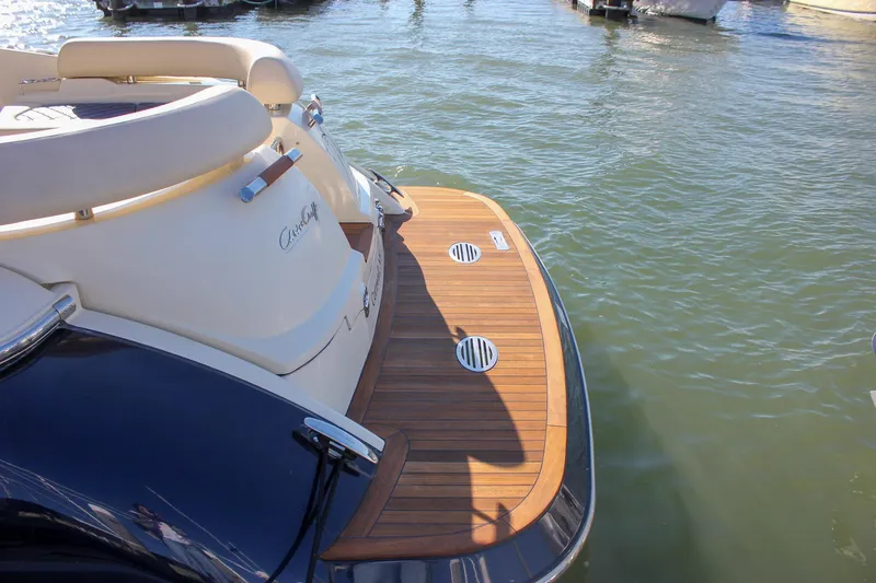 Slide: The Image of Interior view of 2017 Chris-Craft Launch 38, featuring wooden paneling and sleek design elements. - 79