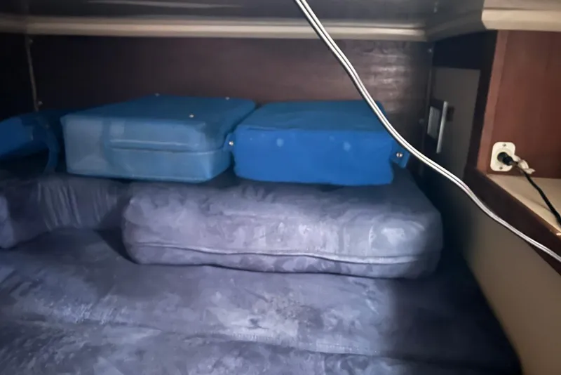 Slide: The Image of Interior cabin of 1988 Catalina 34 mkI with blue cushions and electrical outlet. - 24