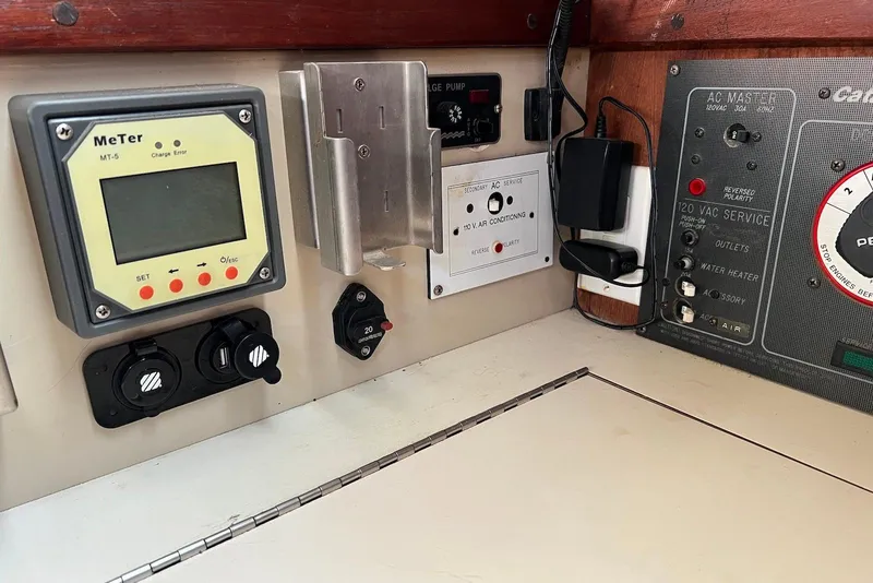 Slide: The Image of Control panel of a 1988 Catalina 34 mkI sailboat with various switches and meters. - 30