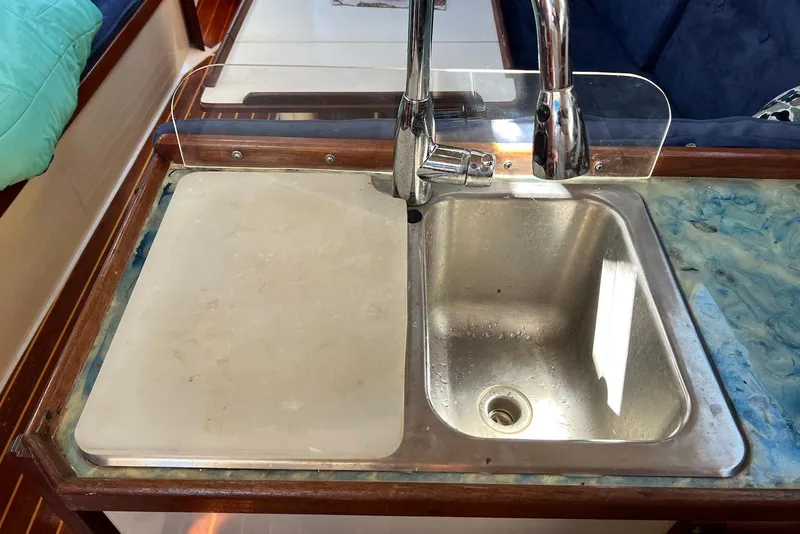 Slide: The Image of Stainless steel sink and faucet in 1988 Catalina 34 mkI yacht galley. - 36