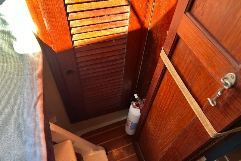 Slide: The Image of Interior of 1988 Catalina 34 mkI sailboat with wooden paneling and fire extinguisher. - 39