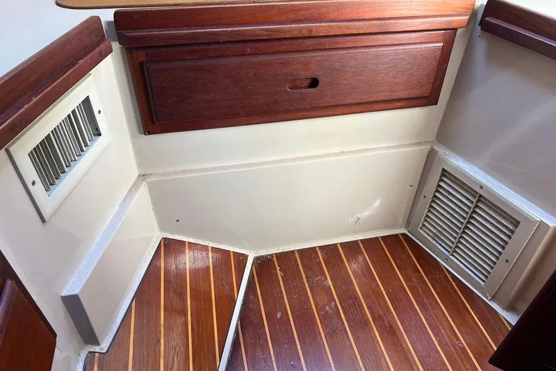 Slide: The Image of 1988 Catalina 34 mkI interior with wood paneling and vented flooring. - 41