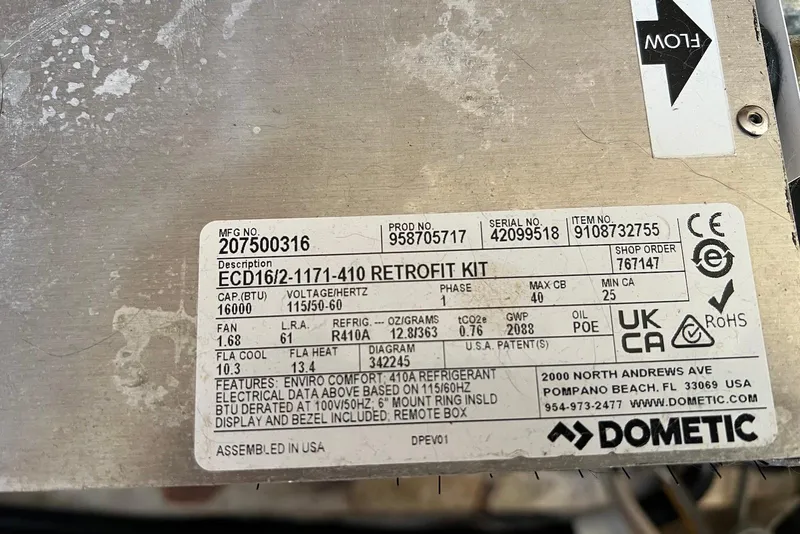 Slide: The Image of Label on Dometic retrofit kit, model ECD16/2-1171-410, showing specifications and certifications. - 44