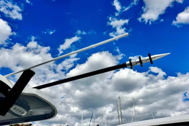 Slide: The Image of Antenna on Parker 2600 Center Console boat against a cloudy blue sky, 2025 model. - 16