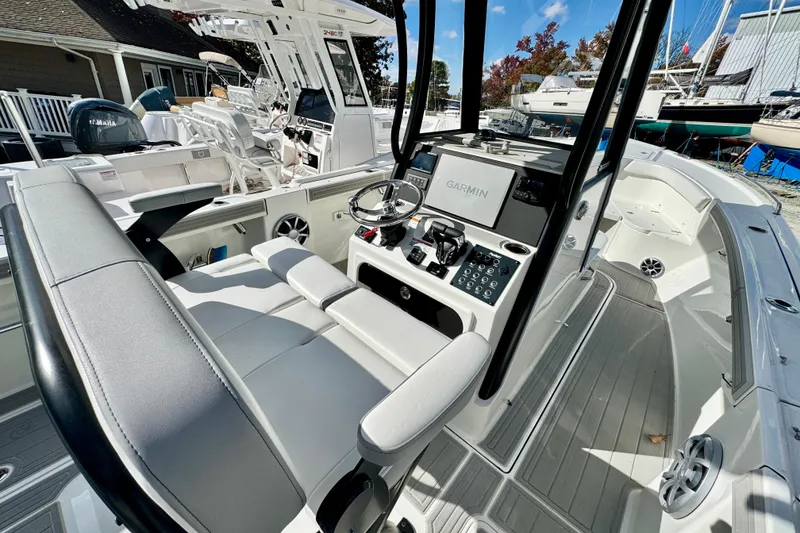 Slide: The Image of 2025 Parker 2600 Center Console boat interior with Garmin navigation system. - 19
