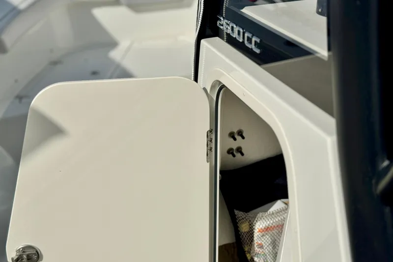Slide: The Image of Open storage compartment on a 2025 Parker 2600 Center Console boat. - 24