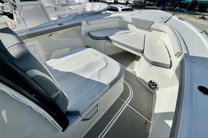 Slide: The Image of 2025 Parker 2600 Center Console boat interior with cushioned seating and modern design. - 26