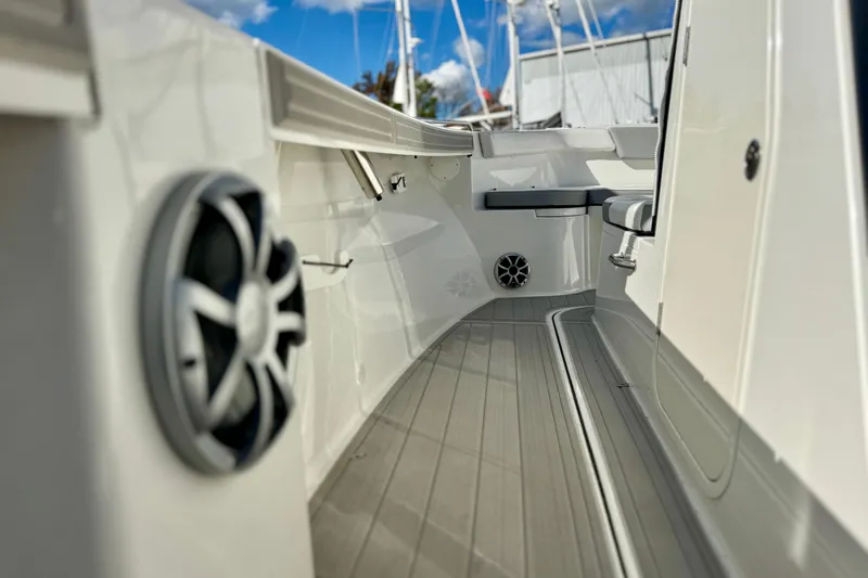 Slide: The Image of 2025 Parker 2600 Center Console boat interior with speakers and seating, showcasing modern design. - 30