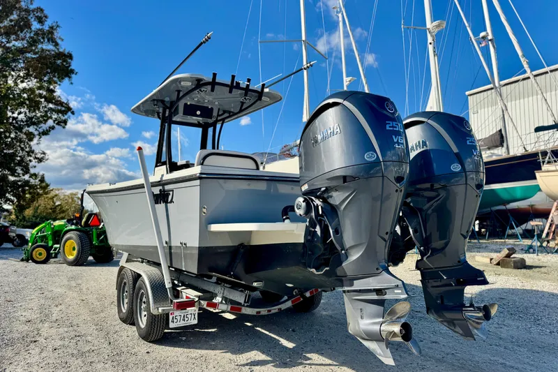 Slide: The Image of 2025 Parker 2600 Center Console boat with dual Yamaha V6 engines on a trailer. - 34