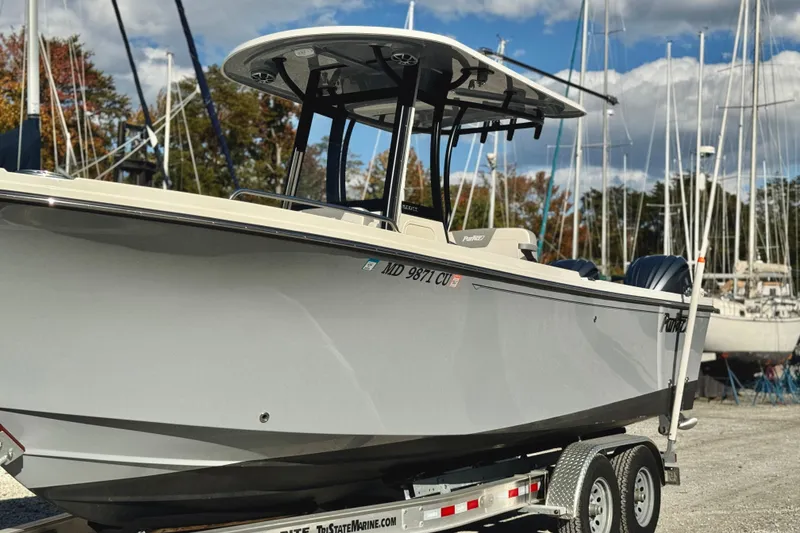 Slide: The Image of 2025 Parker 2600 Center Console boat on trailer in marina setting. - 35