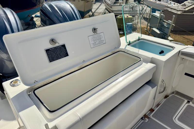 Slide: The Image of 2025 Parker 2600 Center Console boat with open storage compartments and sleek design. - 37