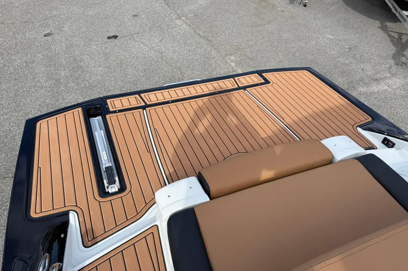 Slide: The Image of 2026 Crownline 298 SS boat deck with sleek, modern teak flooring design. - 18